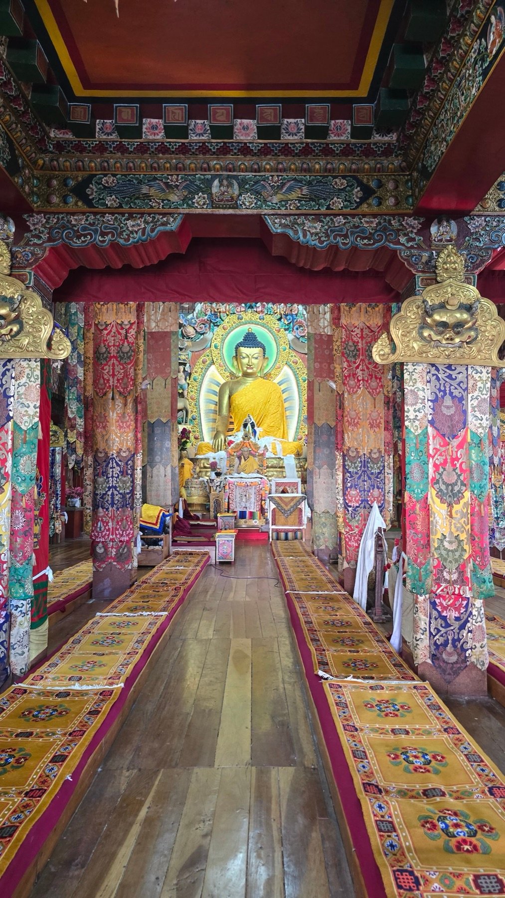 Tawang Monastery prayer hall &mdash; the gilded Buddha in morning light